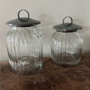 Two countertop storage jars one large(10”h x 5.5”w)and one small(8.5”h x 5.5”w)